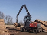 Atlas Material Handler lifting logs